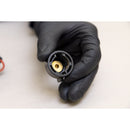 Close-up of 3M disposable spray nozzle showing brass insert used with water-based adhesive applicator.