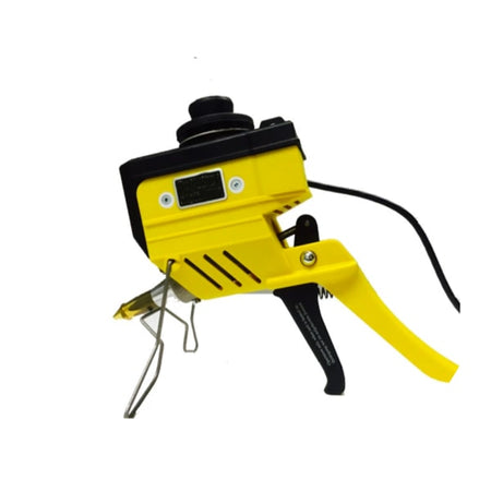 Large yellow and black industrial bulk glue gun standing on table
