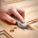 Wood worker removing filled knot with Power Adhesives Mouseplane tool.
