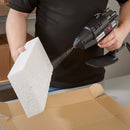 Hot melt spray application from a Tec 6300 glue gun bonding foam packaging components inside a box.