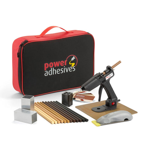 Power Adhesives Knottec kit with Tec 305 glue gun, assorted wood repair glue sticks, shaping tools, and carrying case.
