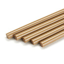 Oak-colored Knottec 7713 polyamide glue sticks shown in a grouped layout for wood filling and surface repair by Power Adhesives.