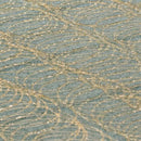 High-detail image of hot melt spray adhesive pattern on foam substrate used in packaging and fabrication.