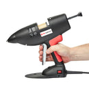 A hand grips the Tec 3500 glue gun, showing trigger reach, handle shape, and overall size during operation.