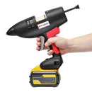 Hand-held view of the Power Adhesives Tec 3508 glue gun with DeWalt Flexvolt battery, showing trigger access and overall scale.