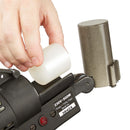 Loading a 1-3/4 inch hot melt adhesive slug into the rear chamber of the Power Adhesives Tec 6300 spray glue gun.