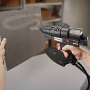 Applying a spiral spray pattern of hot melt adhesive to a flat panel using the Power Adhesives Tec 6300 spray glue gun.