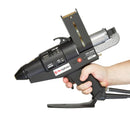 A handheld view of a Tec 7300 hot melt spray applicator highlights grip size, trigger access, and balanced form factor.