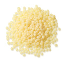 Pile of Pale Amber TEC Bond 214B Hot Melt Pellets