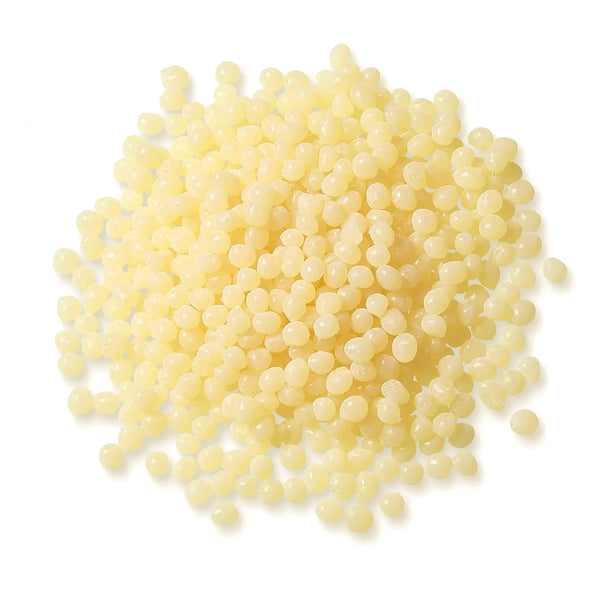Pile of Pale Amber TEC Bond 214B Hot Melt Pellets