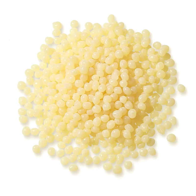 Pile of Pale Amber TEC Bond 214B Hot Melt Pellets