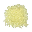 Pile of 611-MC mini chip amber hot melt adhesive from Warren Adhesives.