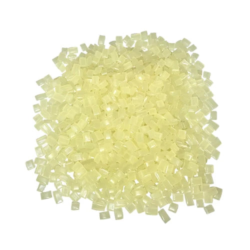 Pile of 611-MC mini chip amber hot melt adhesive from Warren Adhesives.